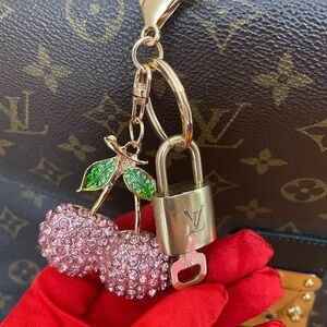 Authentic Louis Vuitton, brass lock and key#317 with unbranded keychain